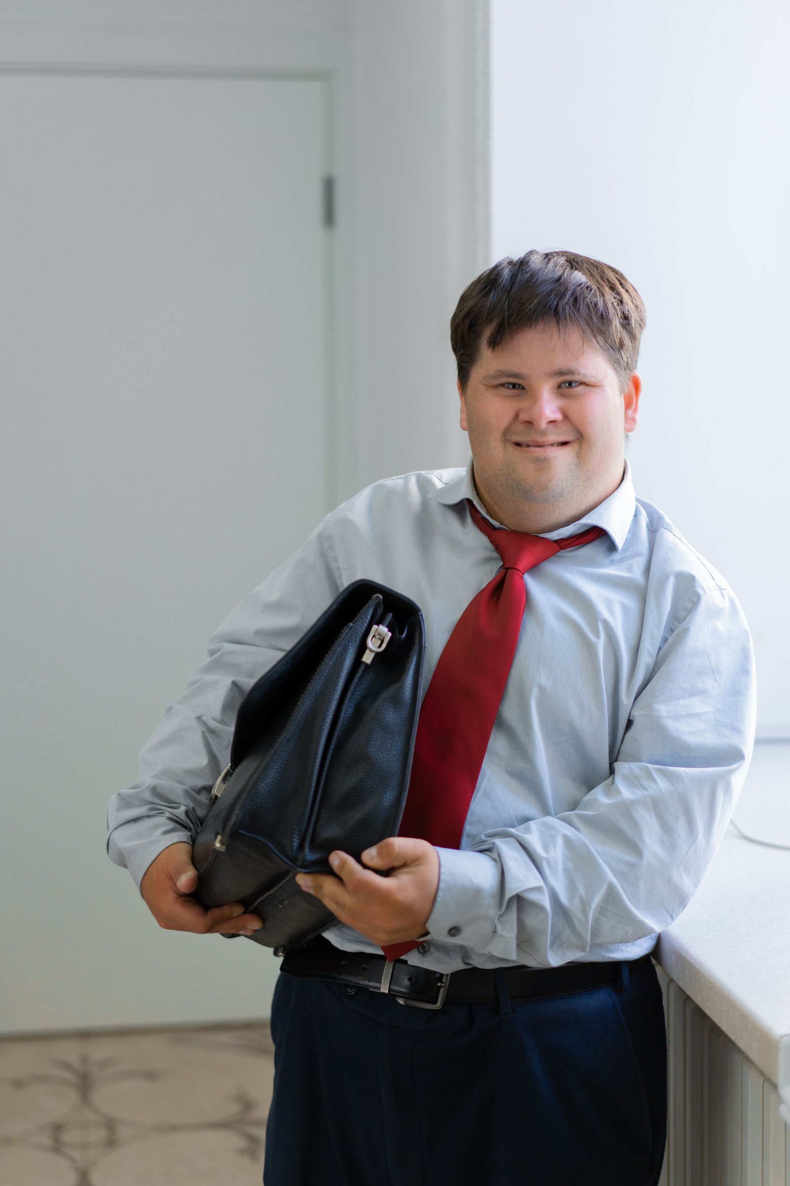 Adult with IDD smiling indoors
