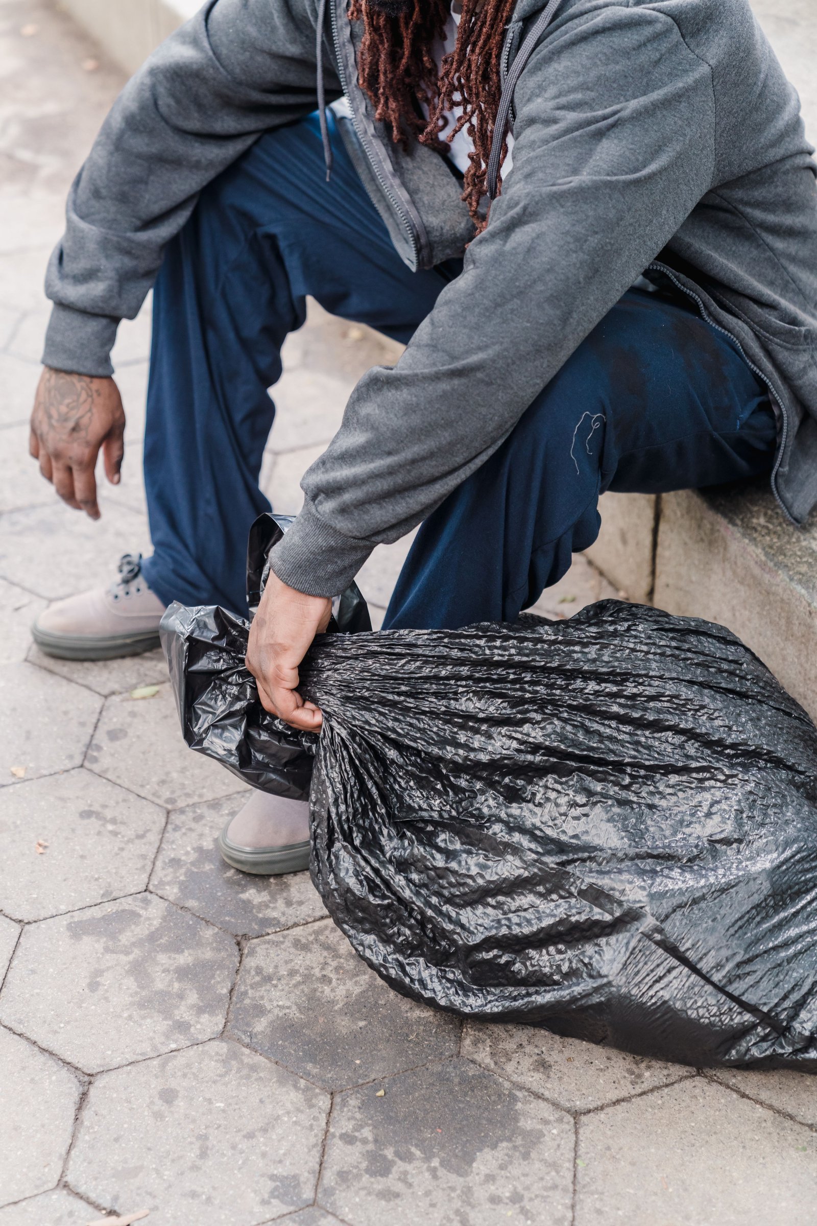 Person carrying belongings outdoors